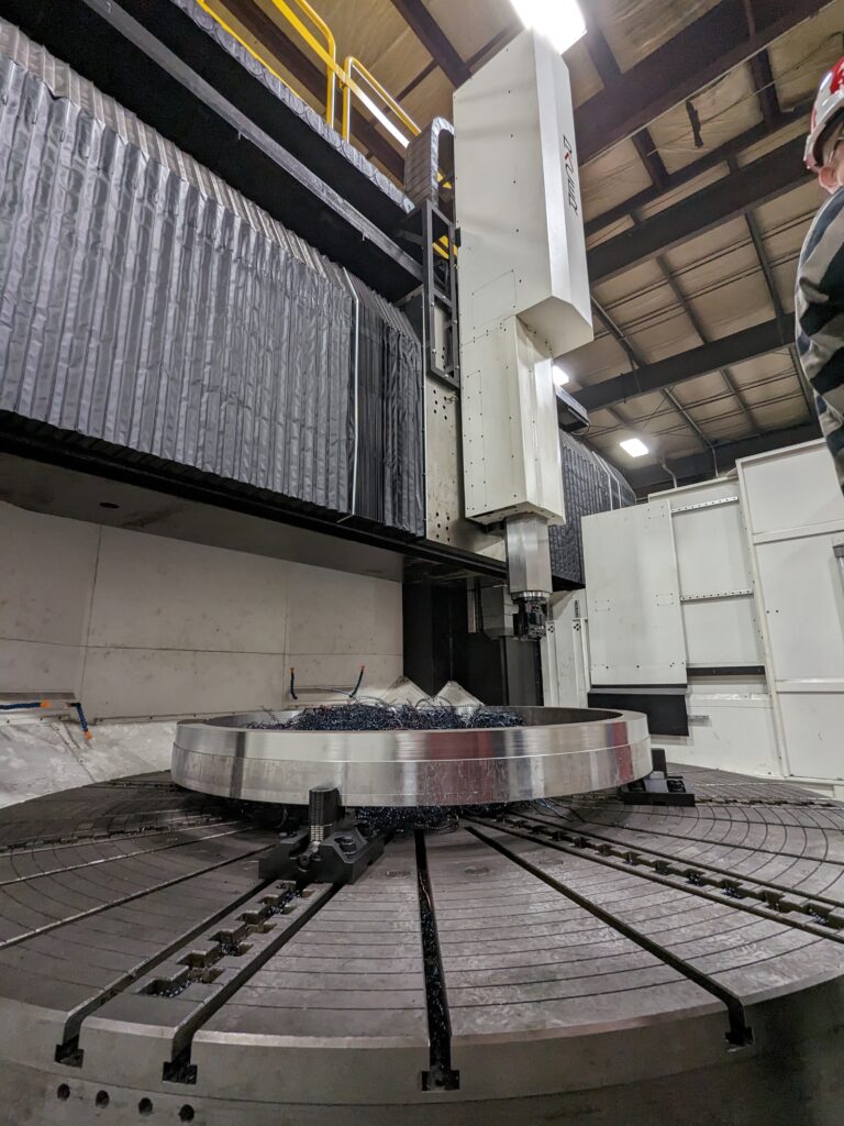 Vertical turning lathe (VTX3500) manufactured by Racer Machinery International, machines a large steel flange part for a prominent forging Canadian company